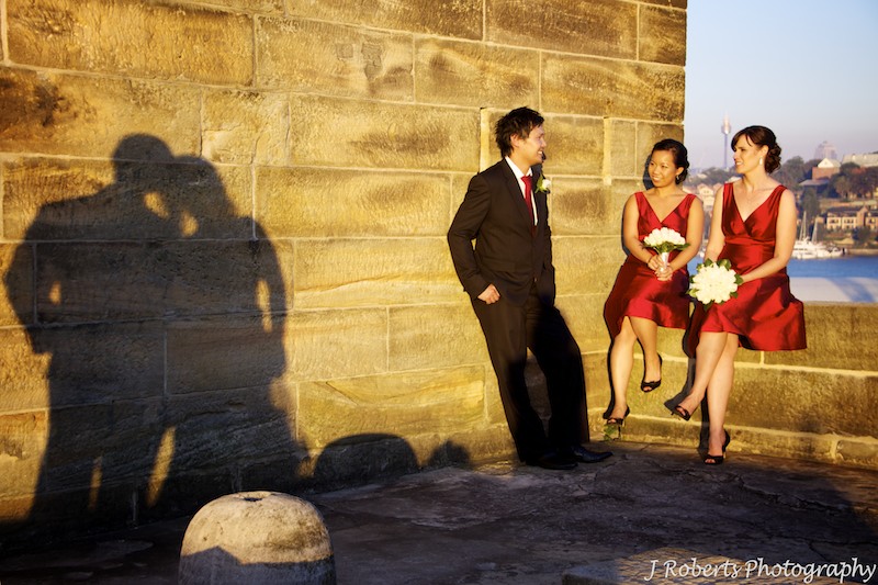 Couple shadows with bridal party - wedding photography sydney
